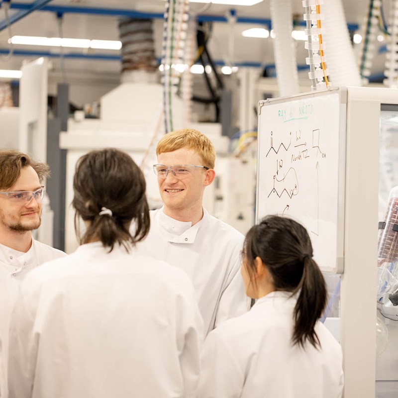 Scientists collaborating in a lab