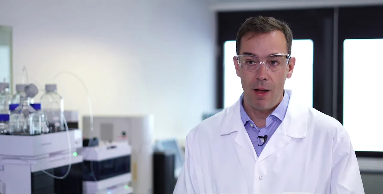 Man in lab facing camera