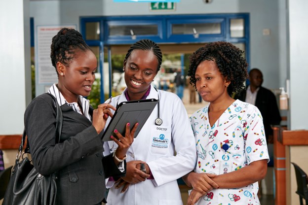 Group of Women looking at a tablet together